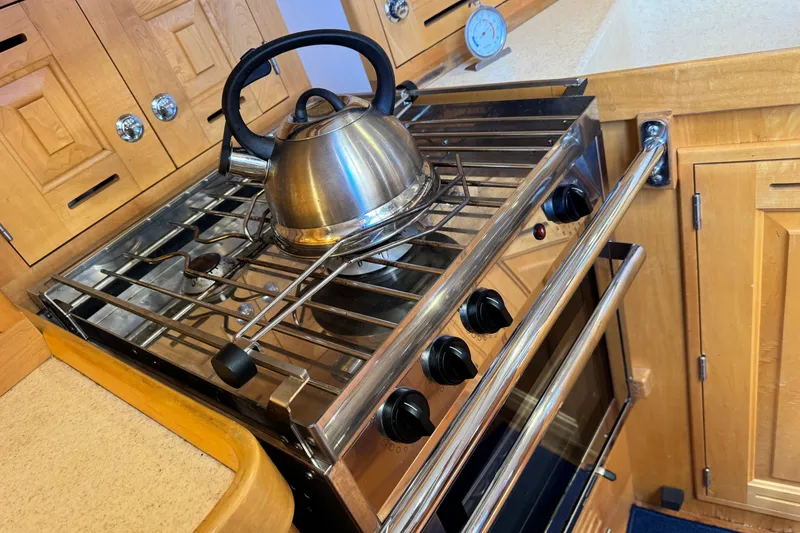 Slide: The Image of Stainless steel stove with kettle in wooden kitchen, Tartan 4000, 2013 model. - 60