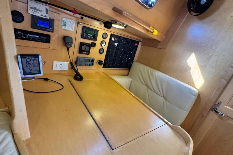 Slide: The Image of Control panel area in a 2013 Tartan 4000 yacht with navigation equipment. - 61