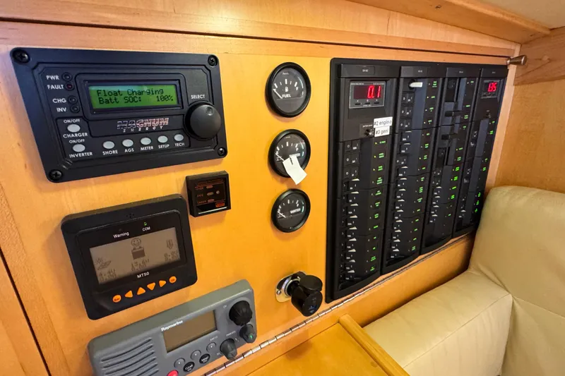 Slide: The Image of Control panel of a 2013 Tartan 4000 yacht with various gauges and displays. - 62