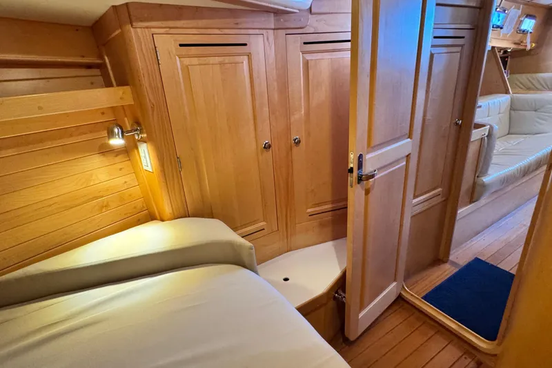 Slide: The Image of Interior of 2013 Tartan 4000 yacht with wooden cabinetry and cozy seating area. - 66