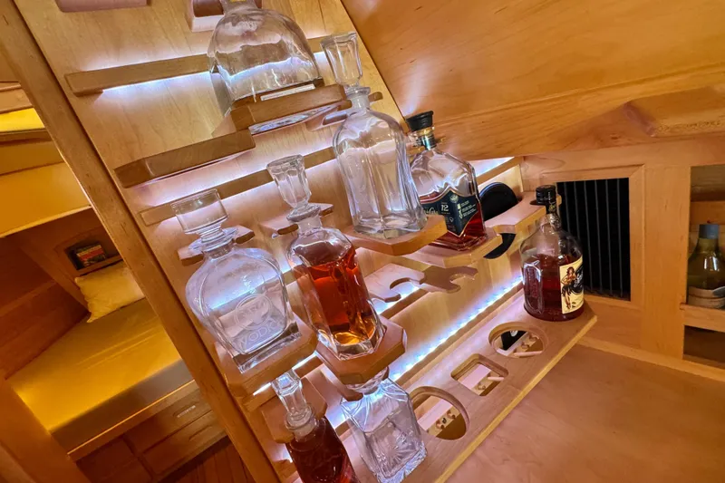 Slide: The Image of Luxurious wooden bar setup in a 2013 Tartan 4000 yacht interior. - 70
