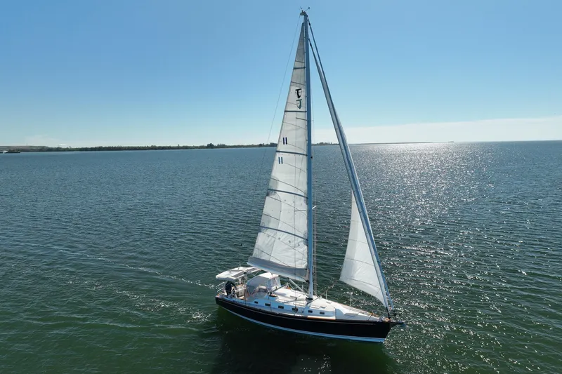 Slide: The Image of Sailing yacht Tartan 4000, 2013 model, gliding on open water under clear skies. - 9