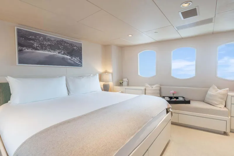 Slide: The Image of Luxurious bedroom interior on 1995 Christensen Tri-Deck yacht with ocean view windows. - 17