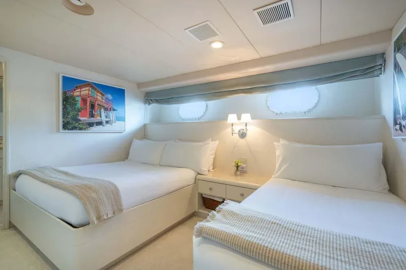 Slide: The Image of Luxurious bedroom on 1995 Christensen Tri-Deck yacht with twin beds and elegant decor. - 22
