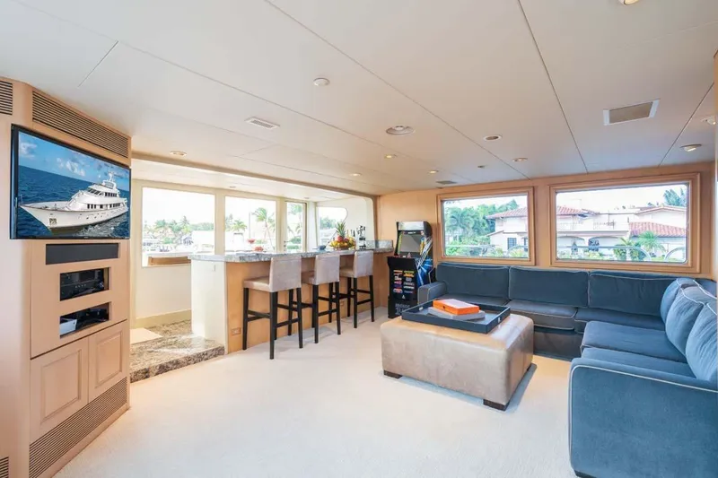 Slide: The Image of Luxurious 1995 Christensen Tri-Deck yacht interior with modern lounge and bar area. - 27