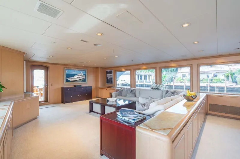 Slide: The Image of Luxurious interior of 1995 Christensen Tri-Deck yacht with elegant furnishings and large windows. - 4