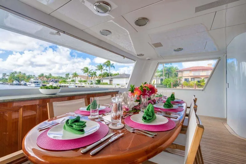 Slide: The Image of Luxurious dining setup on 1995 Christensen Tri-Deck yacht with waterfront view. - 42