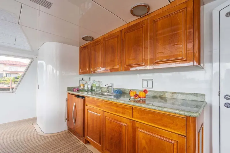 Slide: The Image of Luxurious wooden cabinetry and countertop in 1995 Christensen Tri-Deck yacht interior. - 43