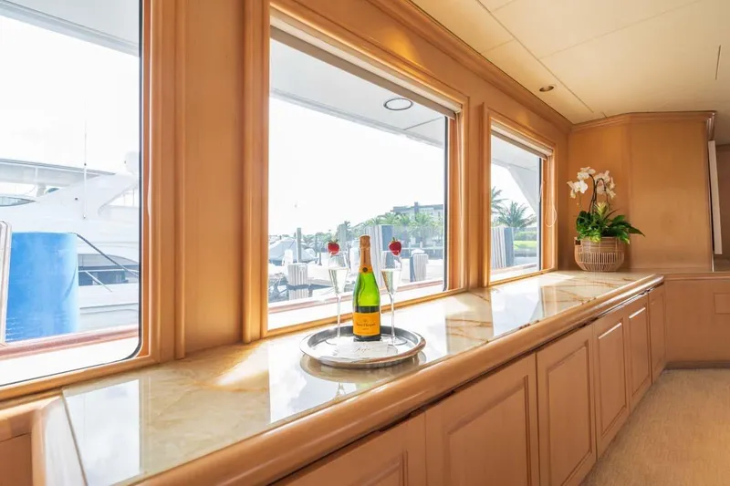 Slide: The Image of Luxurious interior of 1995 Christensen Tri-Deck yacht with champagne and elegant decor. - 5