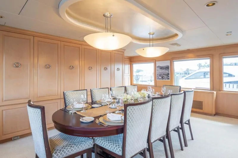 Slide: The Image of Luxurious dining area on 1995 Christensen Tri-Deck yacht with elegant table setting. - 6