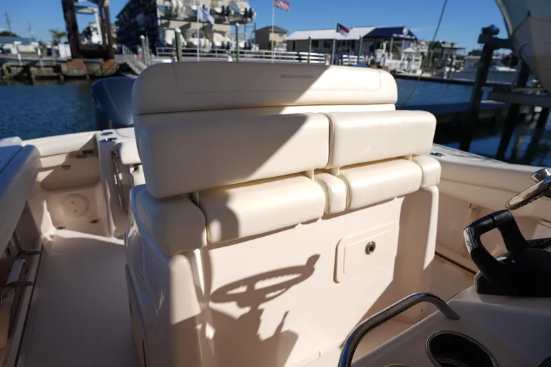 Slide: The Image of 2021 Grady-White Canyon 271 boat interior with helm and seating area. - 29