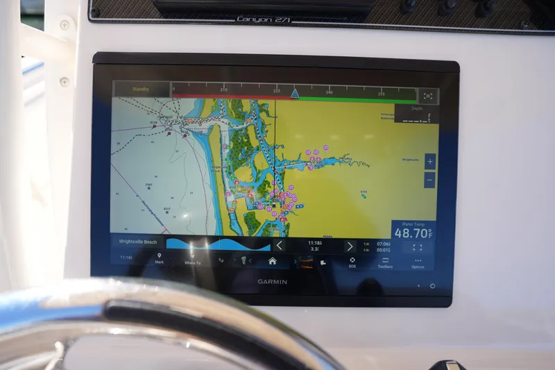 Slide: The Image of Garmin navigation display on 2021 Grady-White Canyon 271 boat, showing coastal map. - 36