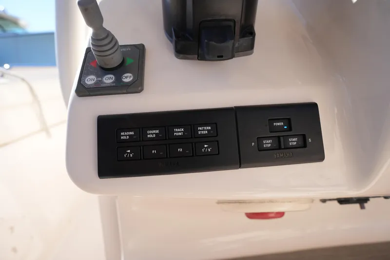 Slide: The Image of Control panel of a 2021 Grady-White Canyon 271 boat with Yamaha controls. - 42