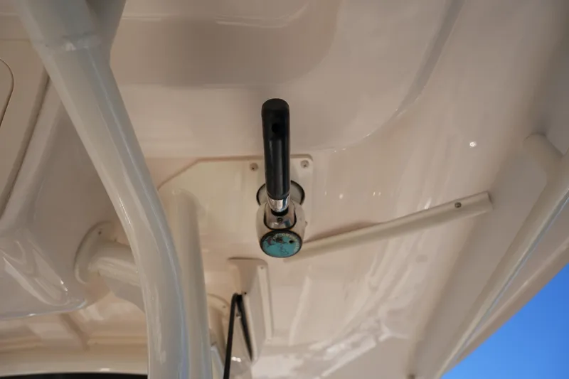 Slide: The Image of 2021 Grady-White Canyon 271 boat detail, featuring a mounted handle under the canopy. - 53