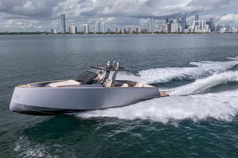 Slide: The Image of 2021 Pardo Yachts 43 cruising on water with city skyline in background. - 10