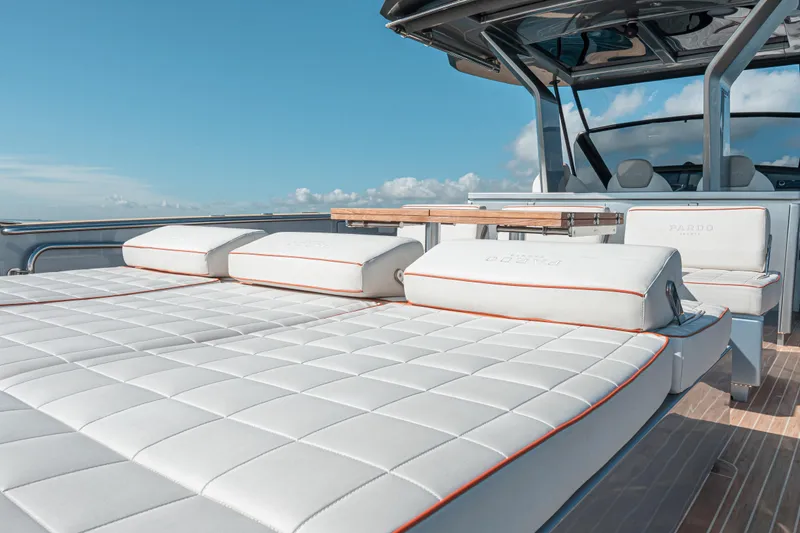Slide: The Image of Luxurious 2021 Pardo Yachts 43 with elegant white seating and sleek design under a clear sky. - 18