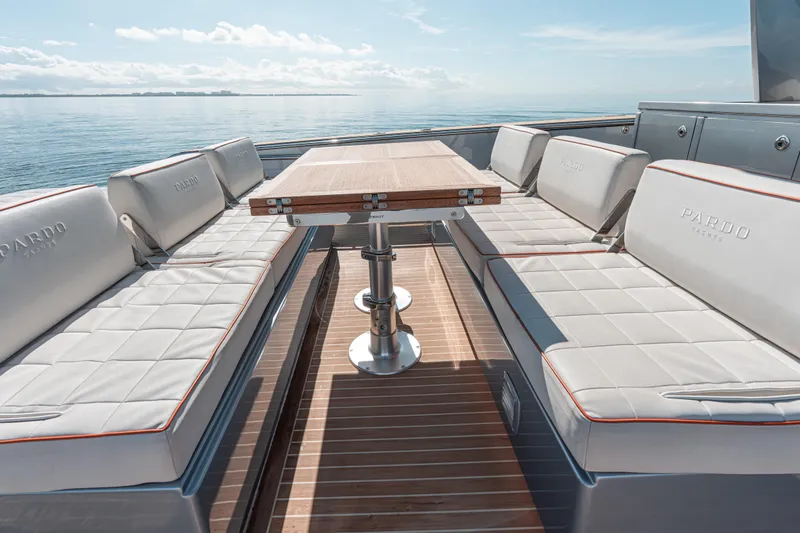 Slide: The Image of Luxurious seating area on 2021 Pardo Yachts 43, featuring elegant cushions and wooden table. - 20