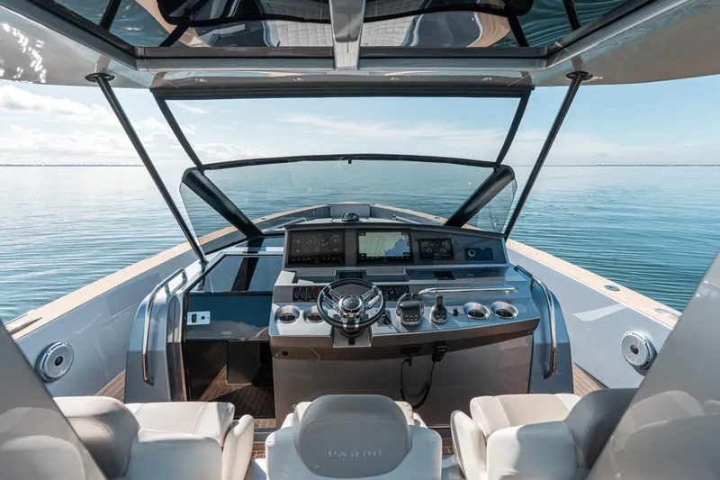 Slide: The Image of Cockpit view of 2021 Pardo Yachts 43, featuring modern navigation equipment and serene ocean backdrop. - 24