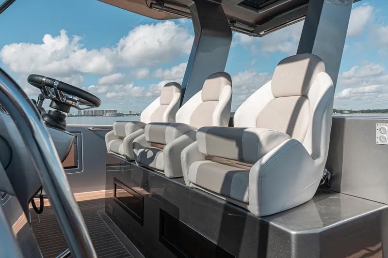 Slide: The Image of Luxury seating on 2021 Pardo Yachts 43, featuring modern helm design and ocean view. - 27