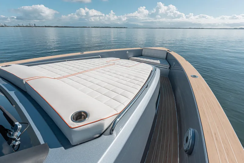 Slide: The Image of 2021 Pardo Yachts 43 luxury deck with cushioned seating on calm water. - 31