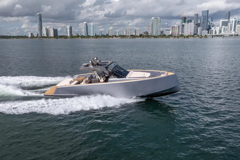 Slide: The Image of 2021 Pardo Yachts 43 cruising on water with city skyline in background. - 8