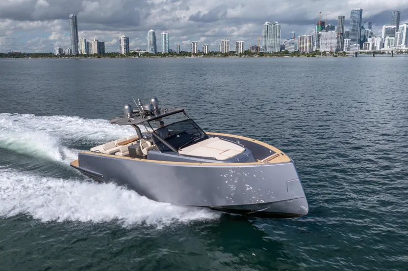 Slide: The Image of 2021 Pardo Yachts 43 cruising on water with city skyline in background. - 9