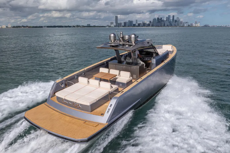 Slide: The Image of Luxury 2021 Pardo Yachts 43 cruising near city skyline on open water. - 14