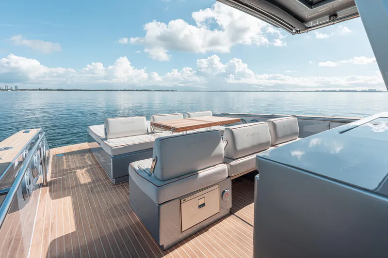 Slide: The Image of Luxurious 2021 Pardo Yachts 43 with elegant deck seating on calm waters. - 21