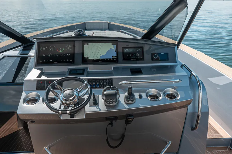 Slide: The Image of Helm of 2021 Pardo Yachts 43 with modern navigation displays and controls. - 25