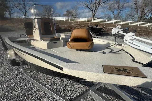 Slide: The Image of 2026 Xpress H20B Bay boat on trailer, featuring sleek design and modern seating. - 10
