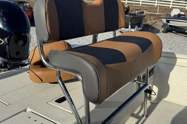 Slide: The Image of 2026 Xpress H20B Bay boat seat with brown and black upholstery, chrome frame. - 11