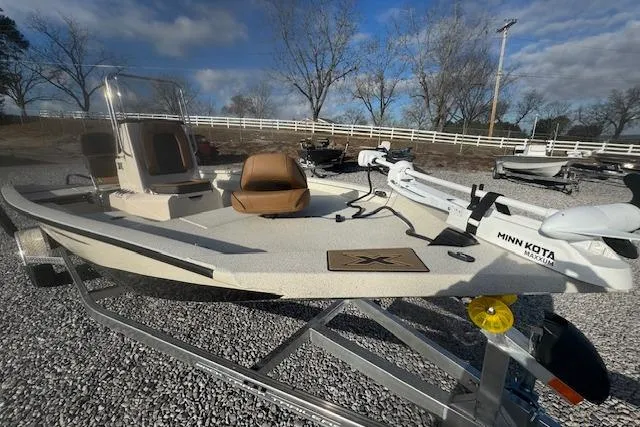 Slide: The Image of 2026 Xpress H20B Bay boat with Minn Kota trolling motor on a trailer. - 9