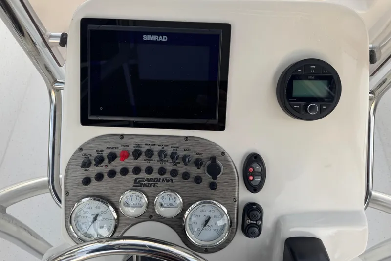 Slide: The Image of Control panel of a 2016 Carolina Skiff 198 DLV boat with Simrad display. - 17