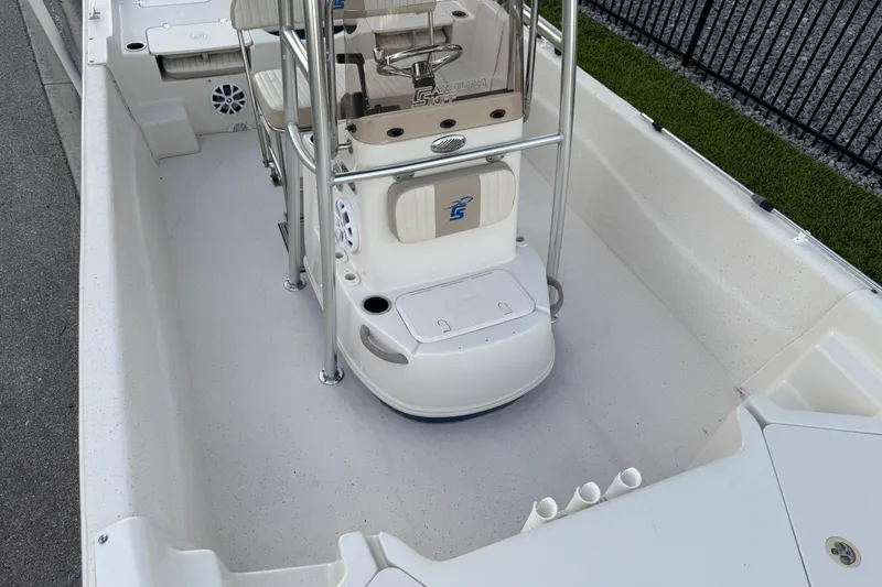 Slide: The Image of 2016 Carolina Skiff 198 DLV boat interior with seating and console. - 25