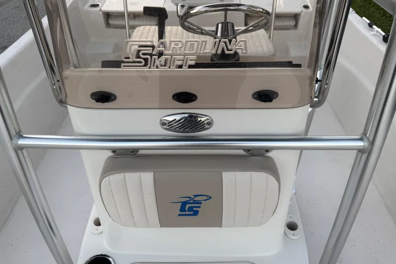 Slide: The Image of 2016 Carolina Skiff 198 DLV boat console with steering wheel and logo. - 26