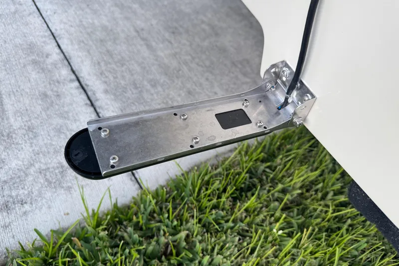 Slide: The Image of 2016 Carolina Skiff 198 DLV boat part on concrete and grass background. - 3