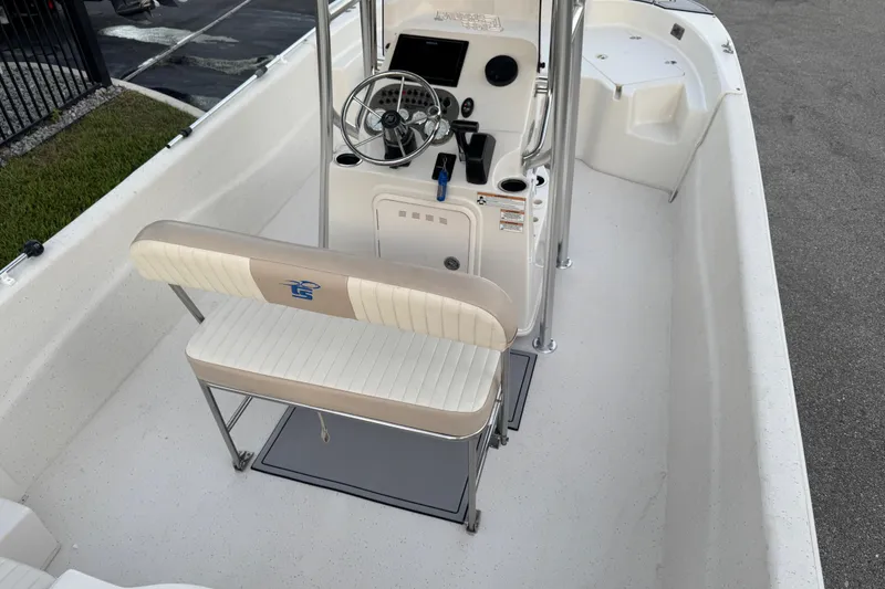 Slide: The Image of 2016 Carolina Skiff 198 DLV boat interior with steering console and seating. - 32