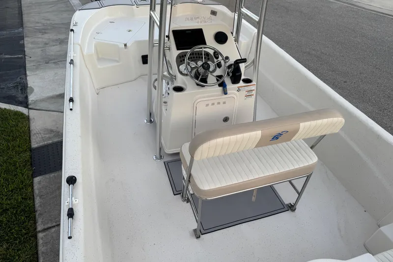 Slide: The Image of 2016 Carolina Skiff 198 DLV boat interior with steering console and seating. - 35