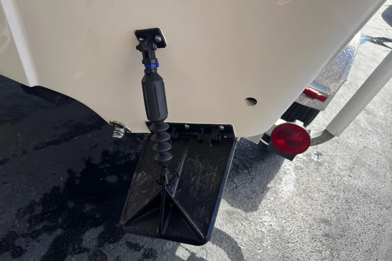 Slide: The Image of 2016 Carolina Skiff 198 DLV boat transom with trim tab and trailer light. - 40