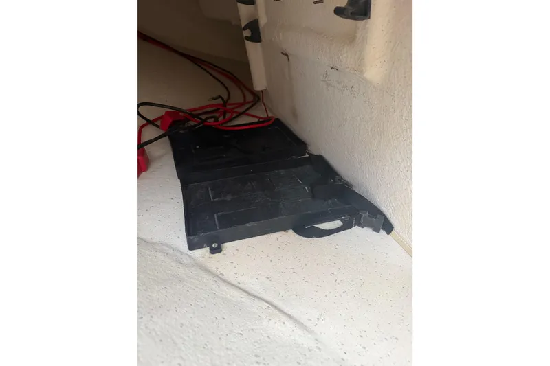 Slide: The Image of Battery compartment with wiring in a 2016 Carolina Skiff 198 DLV boat. - 43