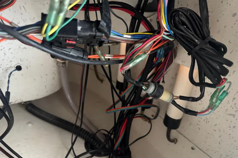 Slide: The Image of Tangled wiring inside a 2016 Carolina Skiff 198 DLV boat. - 51