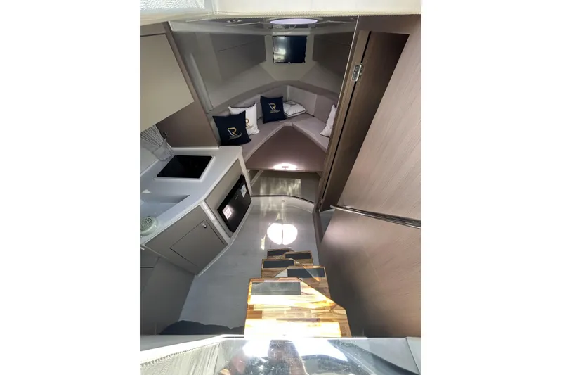 Slide: The Image of Interior of 2025 L'ACQUA LR350 yacht, featuring modern kitchen and cozy seating area. - 18