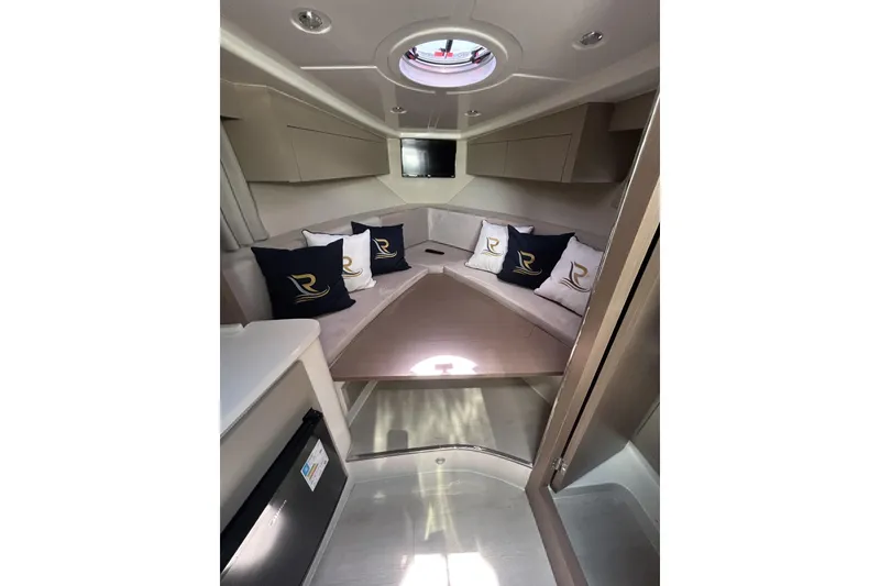 Slide: The Image of Luxurious interior of 2025 L'ACQUA LR350 yacht with elegant seating and cushions. - 19