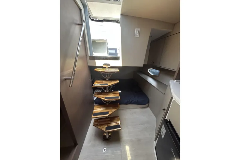 Slide: The Image of Modern L'ACQUA LR350 interior with spiral staircase and compact sleeping area, 2025 model. - 25