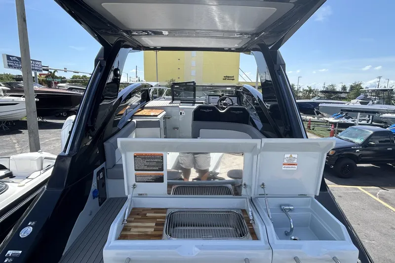 Slide: The Image of Luxury L'ACQUA LR350 boat interior with kitchenette, 2025 model, docked at marina. - 4