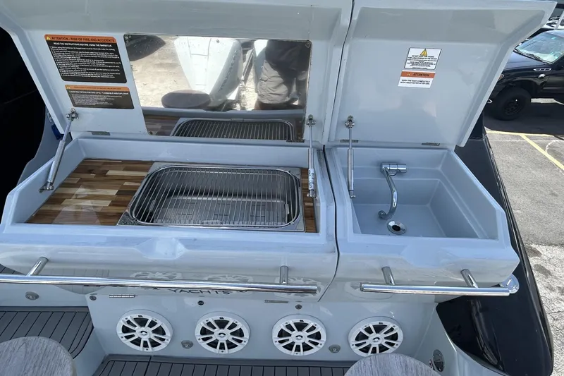 Slide: The Image of Outdoor kitchen setup on L'ACQUA LR350 yacht, featuring grill and sink, 2025 model. - 5