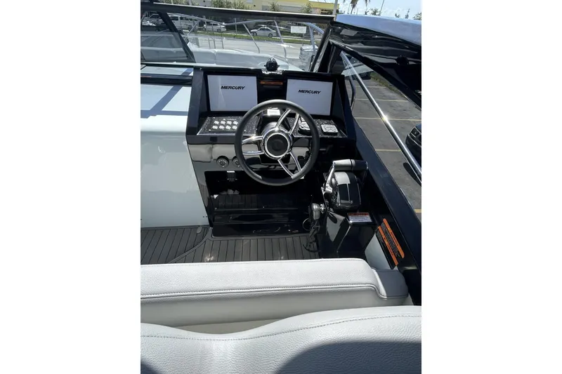 Slide: The Image of Helm of 2025 L'ACQUA LR350 boat with Mercury controls and modern dashboard. - 9