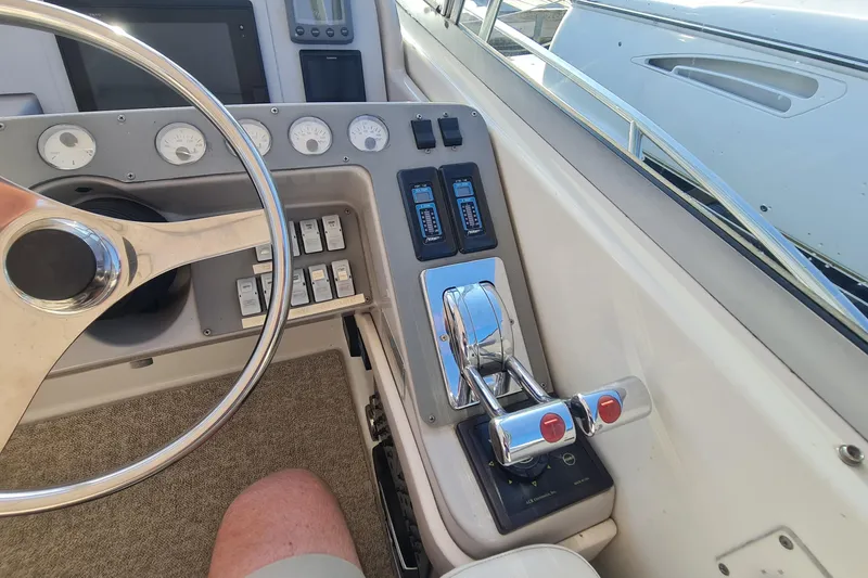 Slide: The Image of 1998 Formula 41 Performance Cruiser helm with steering wheel and control panel. - 10