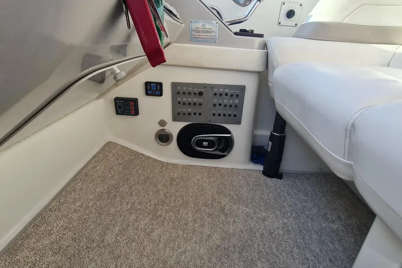 Slide: The Image of 1998 Formula 41 Performance Cruiser interior with control panel and seating area. - 11