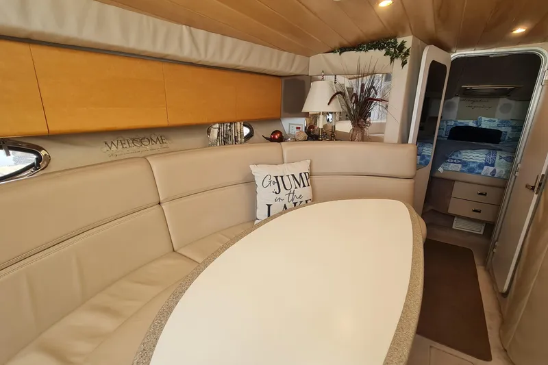Slide: The Image of Interior of 1998 Formula 41 Performance Cruiser with cozy seating and elegant decor. - 14